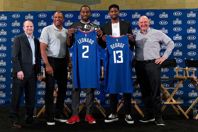 President of Basketball Operations Lawrence Frank, head coach Doc Rivers, Paul George, Kawhi Leonard and owner Steve Ballmer of the Los Angeles Clippers attend the Paul George and Kawhi Leonard introductory press conference at Green Meadows Recreation Center on July 24, 2019 in Los Angeles, California.