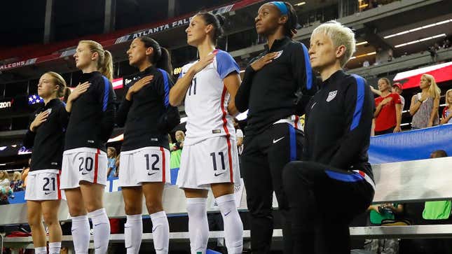Megan Rapinoe takes a knee before a match in 2016.