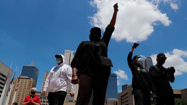 Protesters gather in front of Dallas City Hall in downtown Dallas, Saturday, May 30, 2020