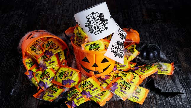 Jack O'lantern bucket of Sour Patch Kids candy and a Sour Patch branded roll of toilet paper