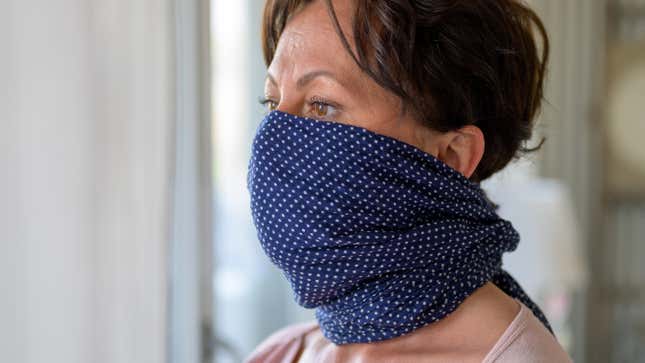 person wearing a scarf over her face