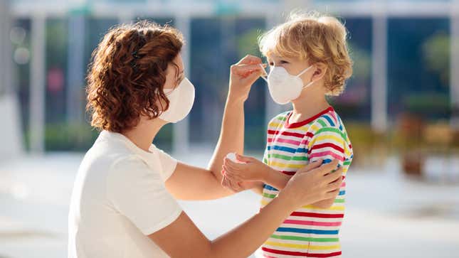 mom and kid with masks