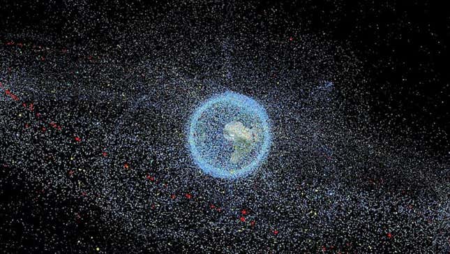 Computer image showing distribution of space debris in orbit around Earth.
