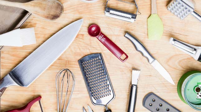 Various kitchen tools seen from above on wooden table