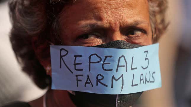 A woman participates in a protest against new farm laws in Mumbai, India, Saturday, Feb. 6, 2021.
