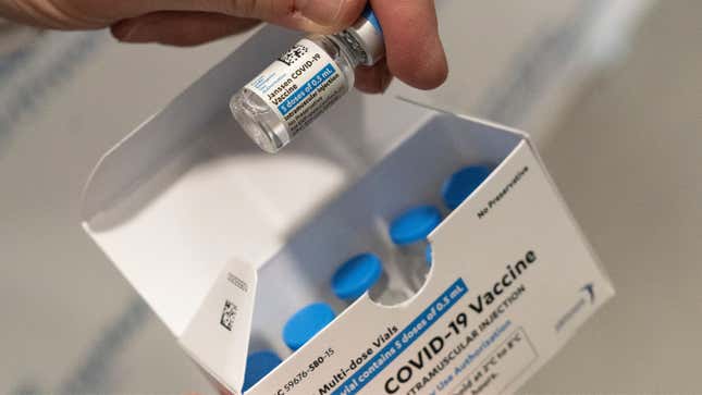 A pharmacist holds a vial of the Johnson &amp; Johnson covid-19 vaccine at a hospital in Bay Shore, N.Y.