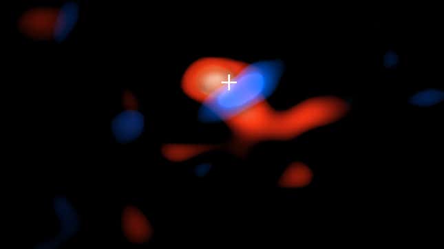ALMA image of the cool gas within the accretion disk. Areas in blue are moving toward us, while the regions in red are moving away—evidence that the accretion disk is spinning around the black hole, which is shown by the crosshair.