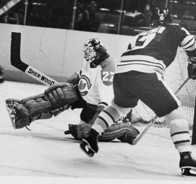 Gilles Meloche makes a save