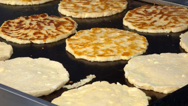 Corn pancakes on griddle