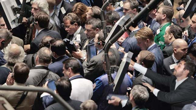 NYSE traders excitedly swarm the piece of actual, tangible currency.