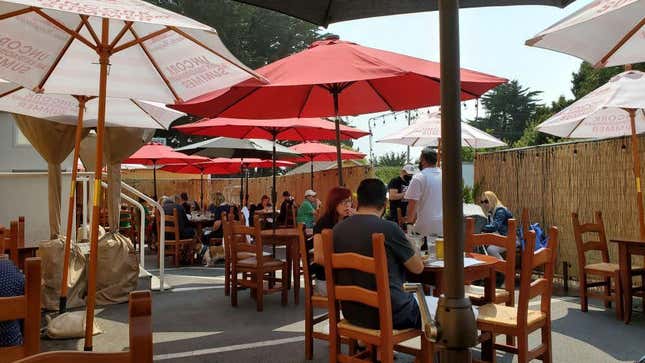 An example of outdoor dining space within a converted parking lot, Half Moon Bay, California (August 2020)