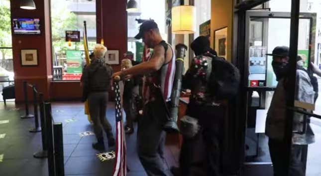 Image for article titled Anti-Lockdown Demonstrators Walk Into North Carolina Subway Armed With Guns and Rocket Launchers
