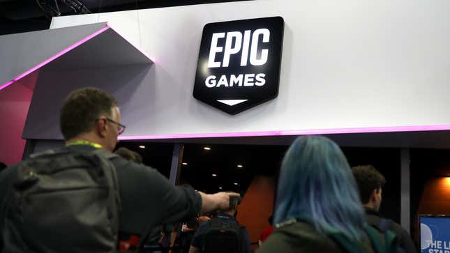  Attendees walk by the Epic Games booth at the 2019 GDC Game Developers Conference on March 20, 2019 in San Francisco, California.