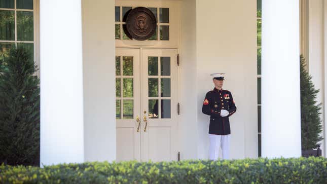 A Marine stands guard outside the West Wing