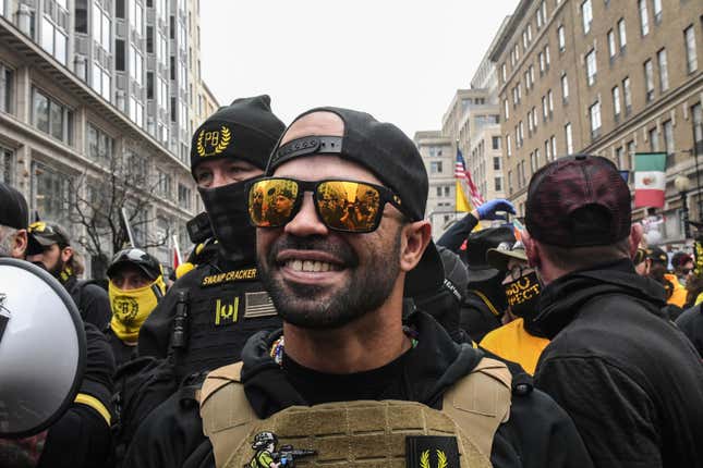 Enrique Tarrio, leader of the Proud Boys, stands outside Harry’s bar during a protest on December 12, 2020 in Washington, DC. Thousands of protesters who refuse to accept that President-elect Joe Biden won the election are rallying ahead of the electoral college vote to make Trump’s 306-to-232 loss official. 