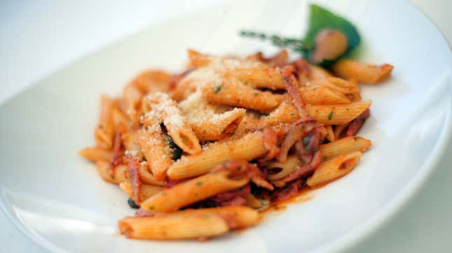Bowl of penne pasta with red sauce