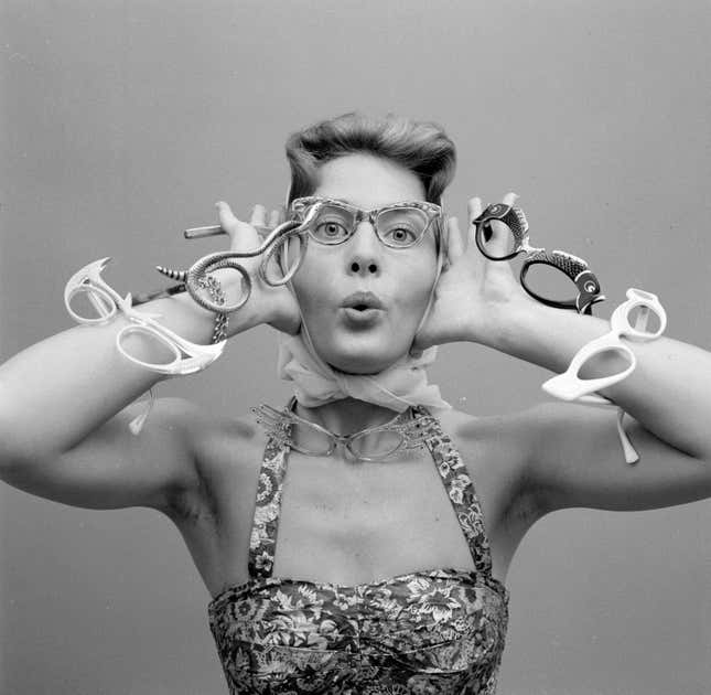 circa 1956: A model with the latest styles of spectacles.
