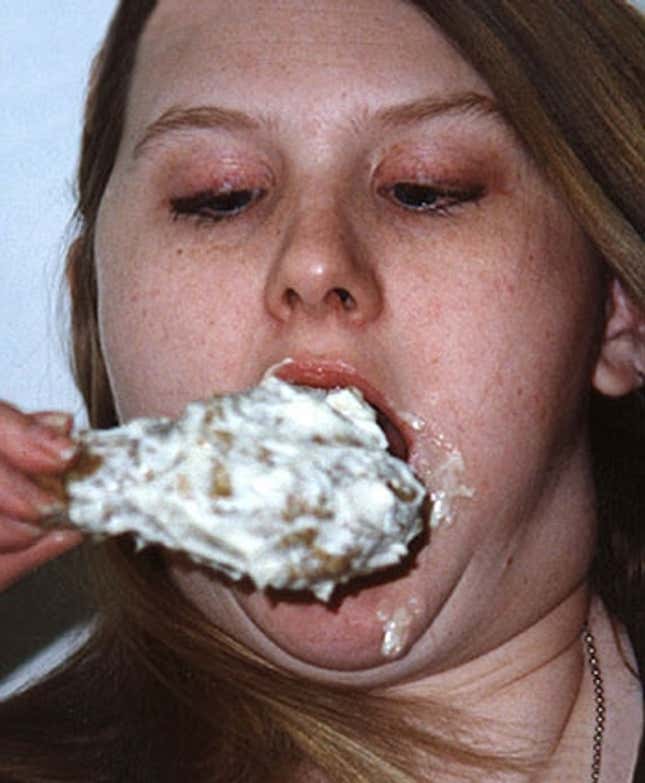 Selma, AL, eater Barb Hodges swallows a chicken drumstick with the aid of Hellmann's QX-1.