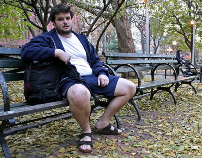 Norton pauses to catch his breath in his trademark shorts and sandals.