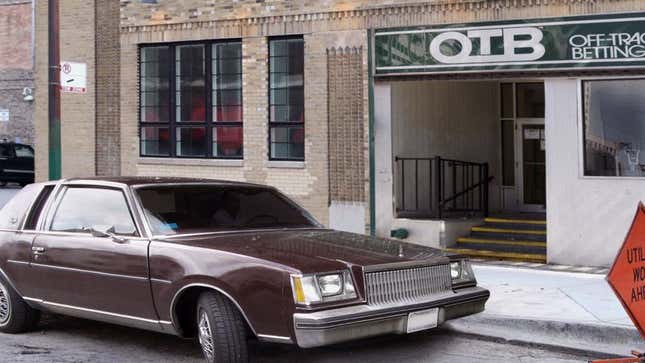 Image for article titled Buick Regal Named Best Vehicle In Class For Idling Outside Off-Track Betting Parlor