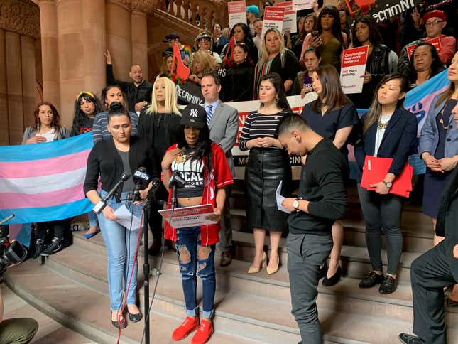 TS Candii, middle, speaking inside the New York State Capitol building in Albany, N.Y., on Tuesday, May 8, 2019. 