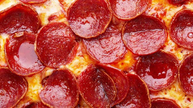 Close-up on slice of pepperoni pizza