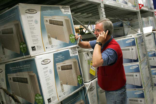 Customer Service Associate talks to a customer on the phone regarding available in-window air conditioners at the Lowe’s home improvement store August 2, 2006 in Arlington Heights, Illinois during a heat wave.