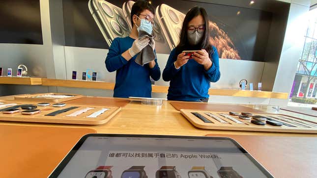 Workers at an Apple store in Beijing on Feb. 19, 2020.