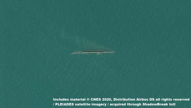 A 50cm resolution image of an Iranian target barge mocked up as a U.S. aircraft carrier capsized outside port at Bandar Abbas, released August 2020.