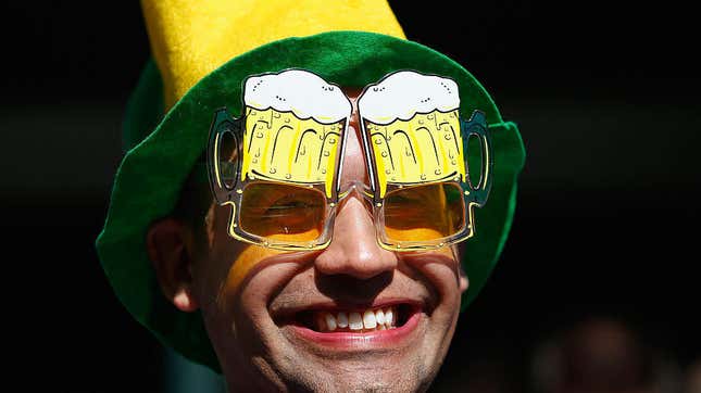 Man smiling wearing glasses shaped to look like beer goggles