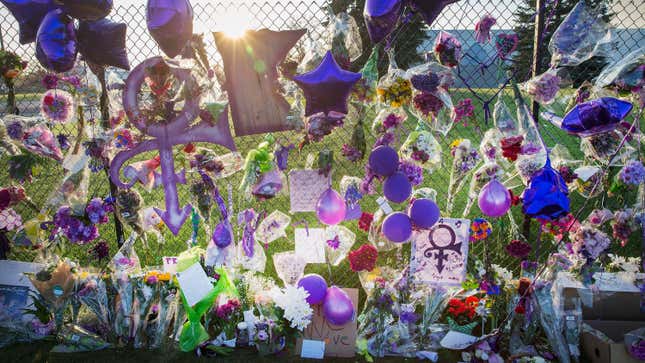 Mementos left by fans on the fence surrounding Paisley Park
