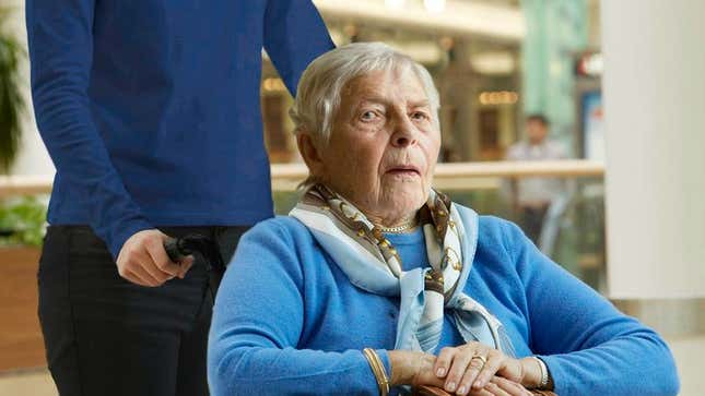 Image for article titled Lucky Old Woman Getting Wheeled Around Airport