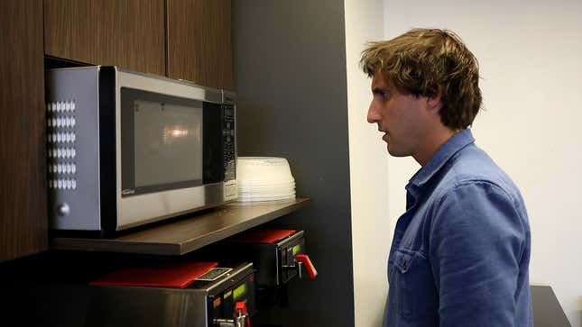 Image for article titled Coworker Apparently Just Going To Stare At Lunch In Microwave For Entire 3-Minute Cook Time