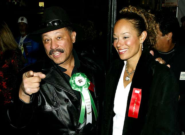 Judge Joe Brown and wife Rhonda Brown (R) poses for a photo before the start of the 72nd Annual Hollywood Christmas Parade November 30, 2003 in Los Angeles, California.