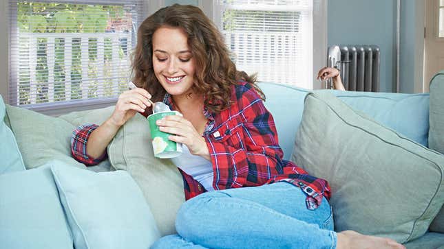 Image for article titled Woman’s Guilty Pleasure Just Sitting On Couch With Pint Of Ice Cream And Watching Man Shackled To Radiator Plead For Mercy