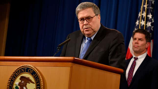 US Attorney General, William Barr (L), and FBI Deputy Director David Bowdich (R) hold a press conference, regarding the December 2019 shooting at the Pensacola Naval air station in Florida, at the Department of Justice in Washington, DC on January 13, 2020.