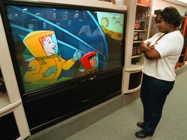 Donna Carter watches an HDTV monitor Sept. 20, 2000 at Douglas TV-Big Screen Store in Mount Prospect, IL.