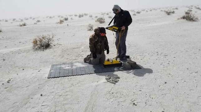 Cyrus Green (left) and Tommy Urban (right) collecting ground-penetrating radar data at White Sands National Monument.