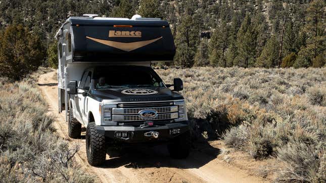 A Ford F-350 With Huge Tires And A Lance 855S Camper Makes A Comfy ...