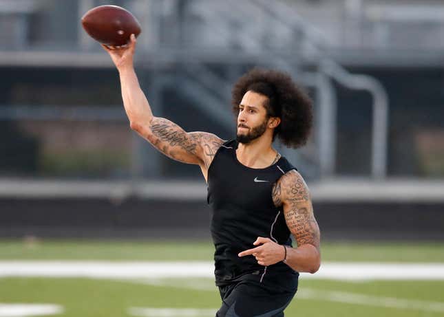 Exiled quarteback Colin Kaepernick hosted his own workout for NFL football scouts and media Nov. 16, 2019, at Charles R. Drew High School in Riverdale, Ga.