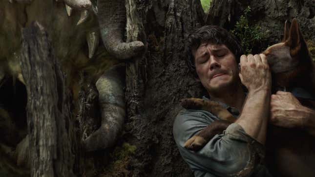 Joel Dawson (Dylan O’Brien) dodges a giant monster while sneaking through the wilderness.