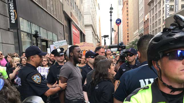 A photo released by Jews for Racial &amp; Economic Justice of organizer Yehudah Webster being taken into custody at a protest against Amazon in Manhattan on Aug. 11, 2019.