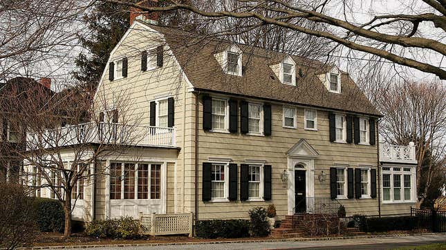The real-life Amityville house in 2005, still recognizable even without those eye-shaped windows.