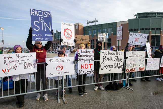 People protest the Washington Redskins name outside Lambeau Field before an NFL football game between the Green Bay Packers and the Washington Redskins Sunday, Dec. 8, 2019, in Green Bay, Wis.