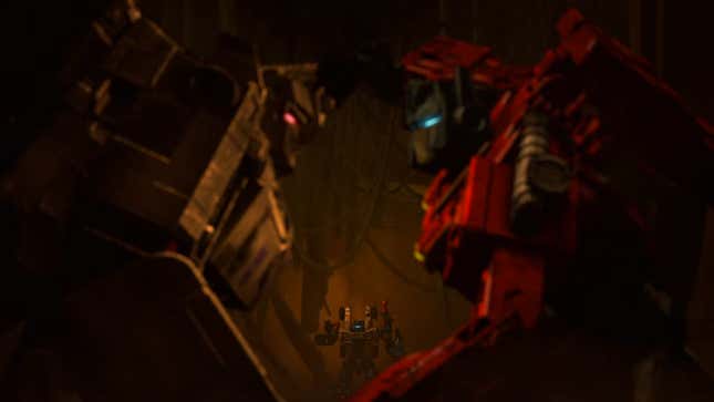 Cog looks on as Optimus and Megatron lock horns again in Transformers: War for Cybertron—Earthrise.