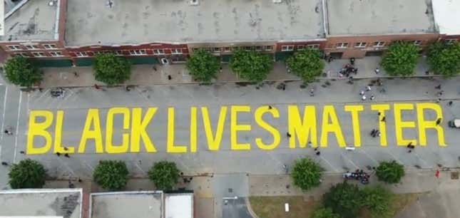 Image for article titled Tulsa Protesters Place Symbolic Tombstones With Names of Black Wall Street Victims on Black Lives Matter Mural in Last-Ditch Effort to Stop Its Removal