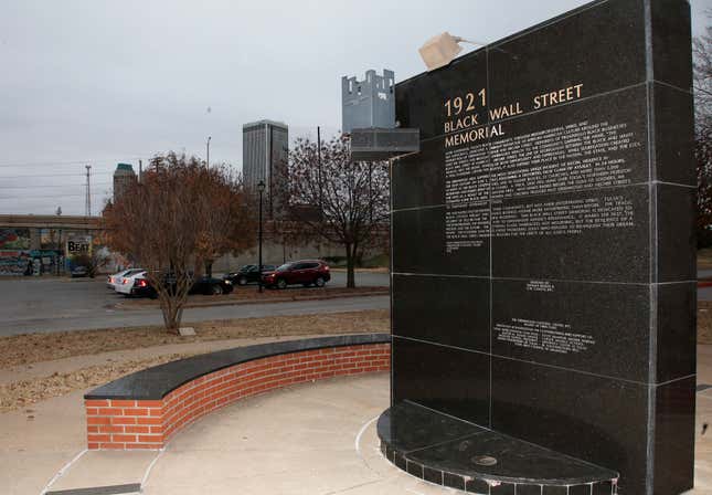 In this Dec. 15, 2016 file photo, a memorial to Tulsa’s Black Wall Street sits outside the Greenwood Cultural Center on the outskirts of downtown Tulsa, Okla. 