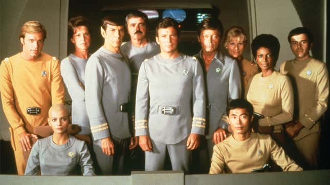 They used up all the color on the poster, so the Enterprise crew had to make do with these outfits instead.