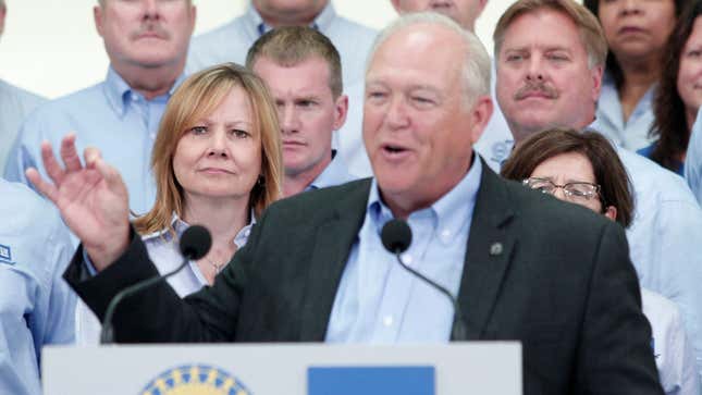 GM CEO looks on at then-UAW President Dennis Williams. 