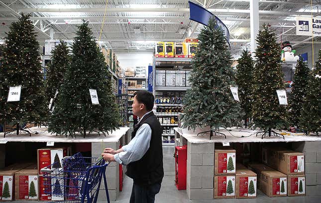  A shopper at a Lowe’s home improvement store walks by a display of artificial Christmas trees on Nov. 4, 2010, in San Francisco.